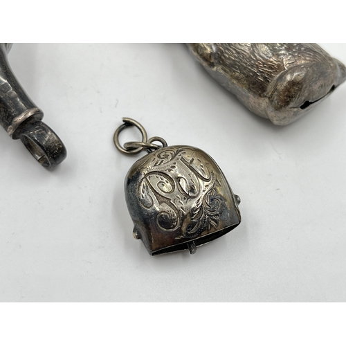 2317 - Three hallmarked sterling silver items, two rattles and one pet bell tag - approx. gross weight 44g