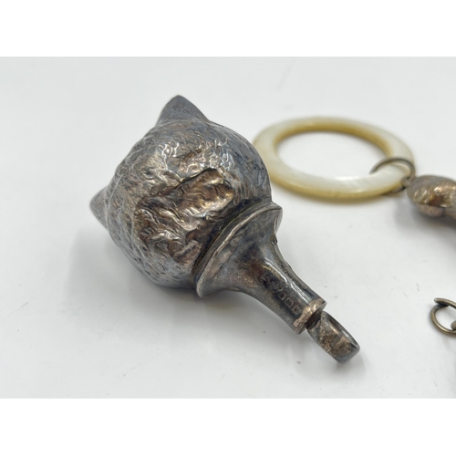 2317 - Three hallmarked sterling silver items, two rattles and one pet bell tag - approx. gross weight 44g