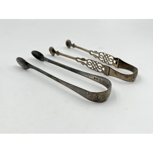 2323 - Two pairs of antique hallmarked sterling silver sugar tongs - approx. gross weight 69g