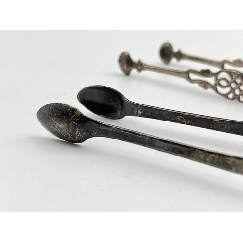 2323 - Two pairs of antique hallmarked sterling silver sugar tongs - approx. gross weight 69g