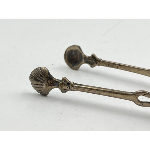 2323 - Two pairs of antique hallmarked sterling silver sugar tongs - approx. gross weight 69g