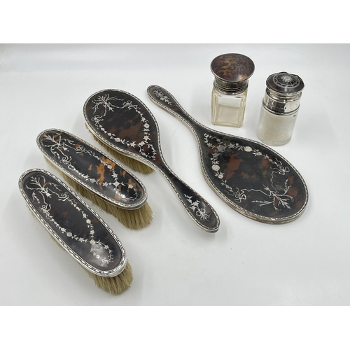 2336 - Six hallmarked sterling silver and tortoiseshell items to include Charles & Richard Comyns four piec... 