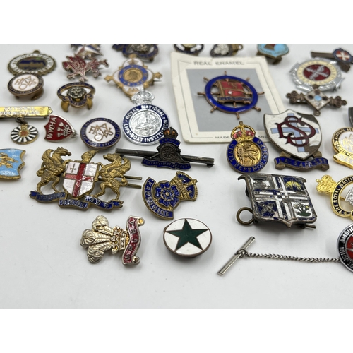 2351 - A collection of base metal and enamel pin badges to include British Legion, Civil Defence Corps etc.