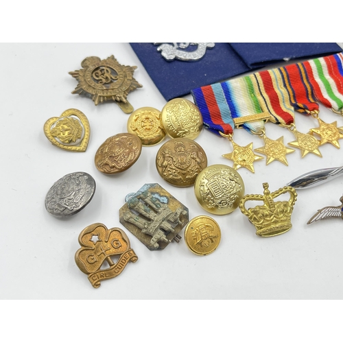 2352 - A collection of medals, buttons, cap and pin badges to include RAF, Royal Navy, 1939-1945 War medal,... 