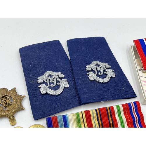 2352 - A collection of medals, buttons, cap and pin badges to include RAF, Royal Navy, 1939-1945 War medal,... 