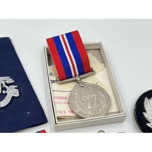 2352 - A collection of medals, buttons, cap and pin badges to include RAF, Royal Navy, 1939-1945 War medal,... 