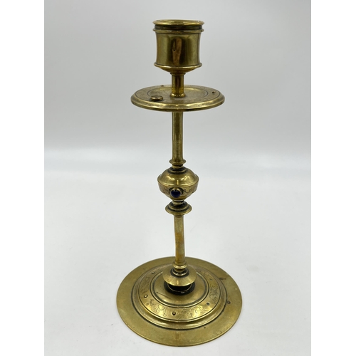 2354 - An Arts and Crafts etched brass candlestick with blue cabochon stone - approx. 20cm high