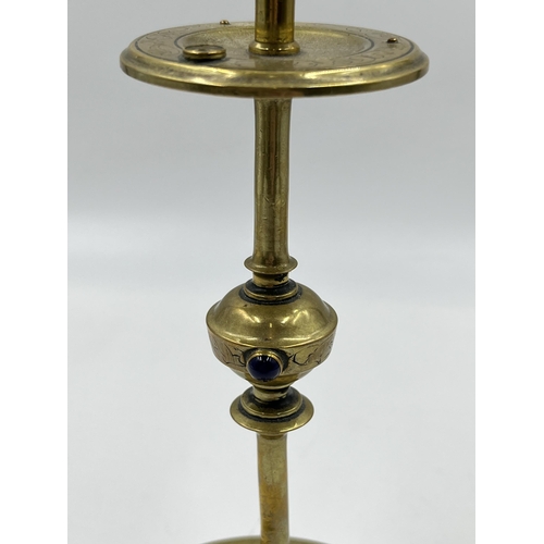 2354 - An Arts and Crafts etched brass candlestick with blue cabochon stone - approx. 20cm high