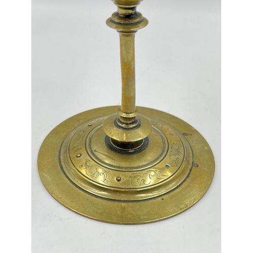 2354 - An Arts and Crafts etched brass candlestick with blue cabochon stone - approx. 20cm high