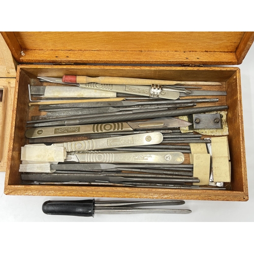 2354A - Three wooden boxes containing tools to include Wilson glass cutters, Swann-Morton stainless steel sc... 