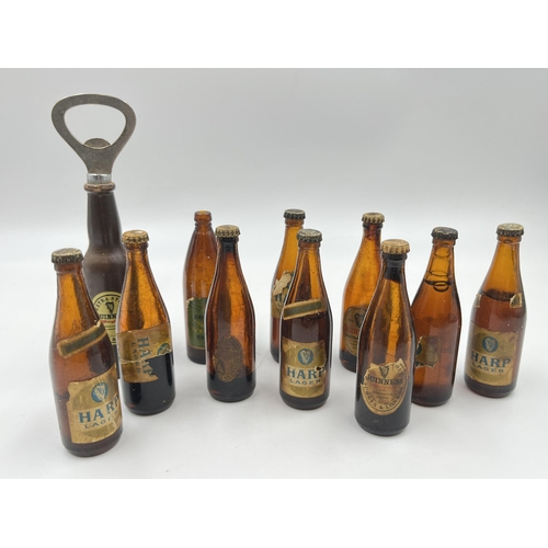 2360 - A collection of vintage miniature glass beer bottles together with Guinness bottle opener