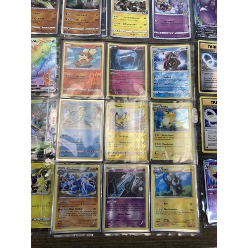 377 - A collection of Pokémon cards to include Pikachu, Machamp etc.