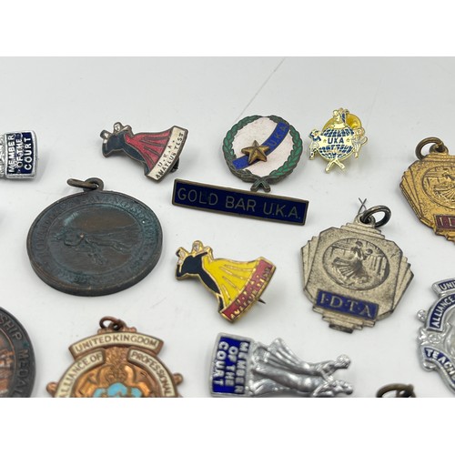 2366 - A collection of vintage medals and badges to include Alliance of Professional Teachers of Dancing et... 