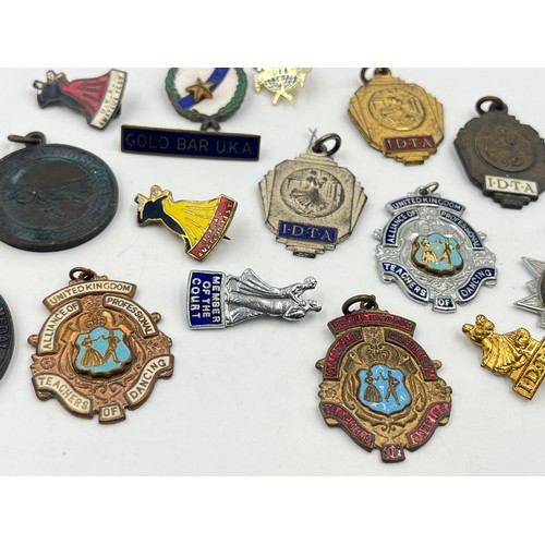 2366 - A collection of vintage medals and badges to include Alliance of Professional Teachers of Dancing et... 