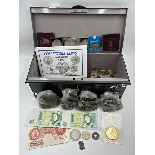 2377 - A vintage deed box containing a collection of British coins and banknotes to include late 1950s ten ... 