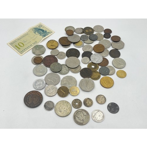 2370 - A collection of world coins to include 40% silver 1968 'Kennedy' dollar, 50% silver 1934 New Zealand... 