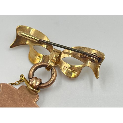 2386 - An early 20th century hallmarked 9ct gold fob with mounted 9ct gold ribbon brooch - approx. gross we... 