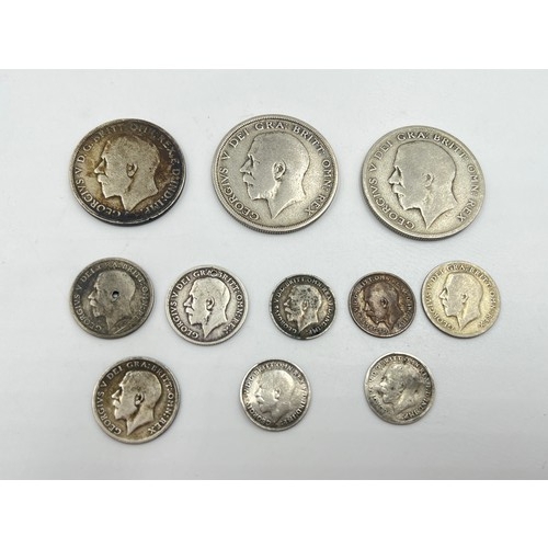 2374 - Eleven silver George V coins to include four 92.5% threepences, two 92.5% silver sixpences (one dril... 