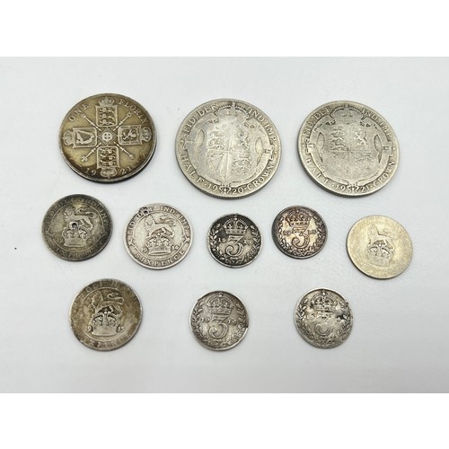 2374 - Eleven silver George V coins to include four 92.5% threepences, two 92.5% silver sixpences (one dril... 