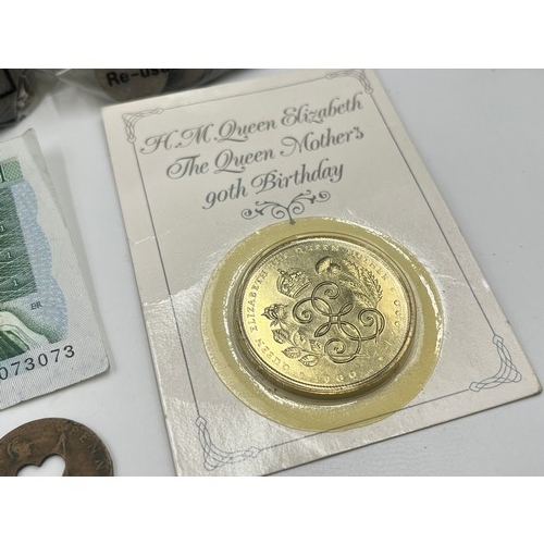 2377 - A vintage deed box containing a collection of British coins and banknotes to include late 1950s ten ... 