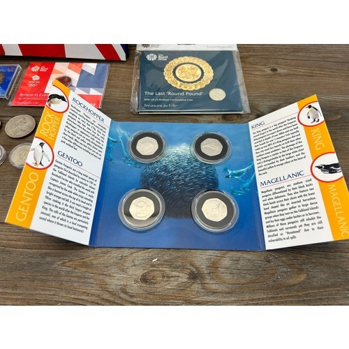 2378 - A collection of British Coins to include Penguins The Falkland Islands four coin set, 1901-2001 £5, ... 