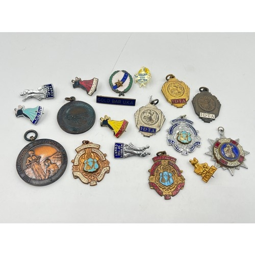 2366 - A collection of vintage medals and badges to include Alliance of Professional Teachers of Dancing et... 