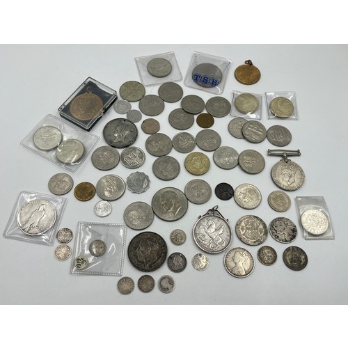 2384 - A collection of tokens, medals and coins with silver examples to include 75% Polish 5 Złotych, two 5... 