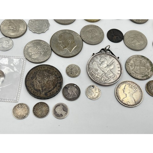 2384 - A collection of tokens, medals and coins with silver examples to include 75% Polish 5 Złotych, two 5... 