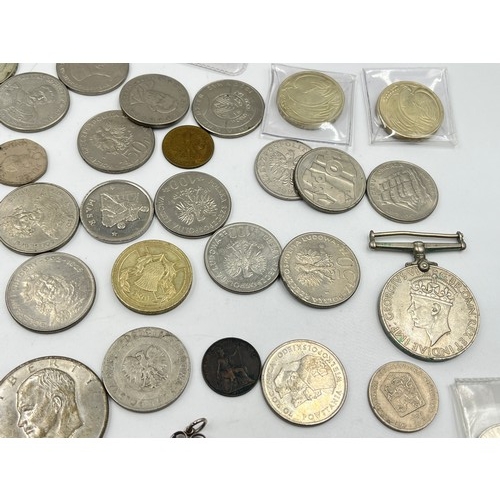 2384 - A collection of tokens, medals and coins with silver examples to include 75% Polish 5 Złotych, two 5... 