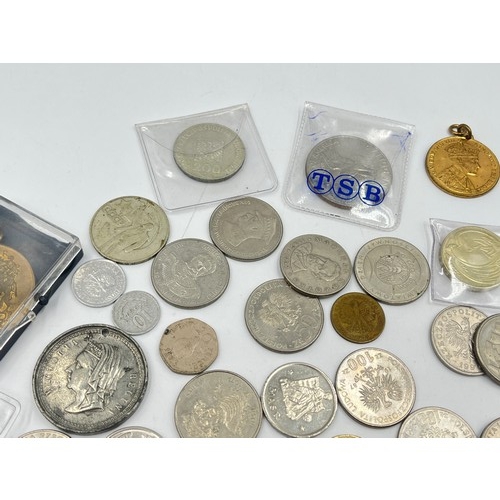 2384 - A collection of tokens, medals and coins with silver examples to include 75% Polish 5 Złotych, two 5... 