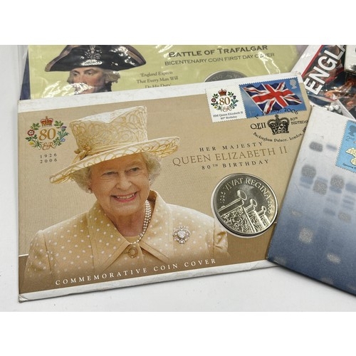 2379 - A collection of packaged coins and banknotes to include 2004, 2005, 2006 £5 first day coin covers, 9... 