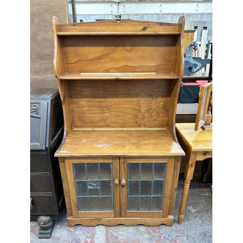 60 - A pine dresser with two lower leaded glazed doors