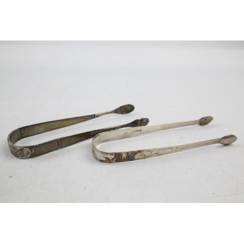 2154 - Two pairs of antique hallmarked sterling silver sugar tongs - approx. gross weight 63g