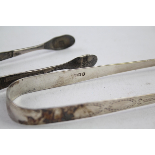 2154 - Two pairs of antique hallmarked sterling silver sugar tongs - approx. gross weight 63g