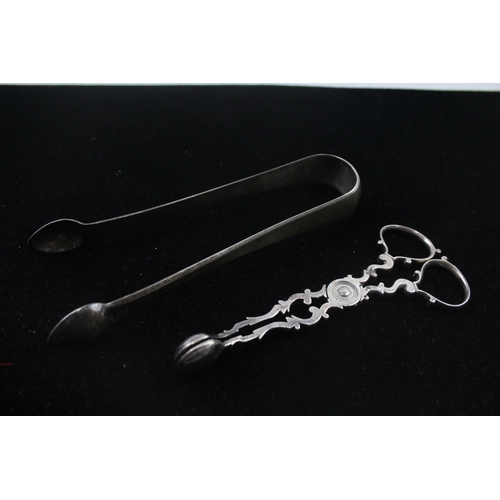 2161 - Two pairs of antique hallmarked sterling silver sugar tongs - approx. gross weight 71g