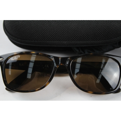 2171 - Three pairs of cased sunglasses, one Ray-Ban and two Oakley