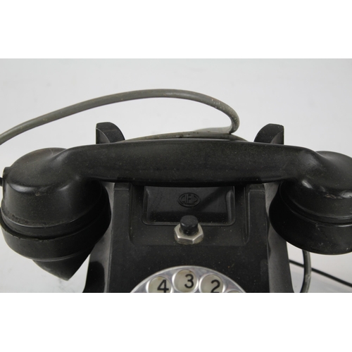 551 - A vintage bakelite rotary telephone