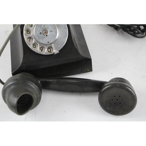 551 - A vintage bakelite rotary telephone