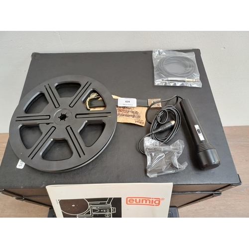 609 - A cased Eumig S938 stereo sound Super8 cine projector with microphone, spool and instruction manual