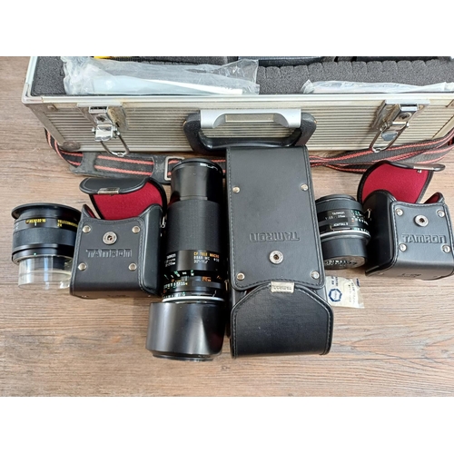 610 - A collection of cameras and accessories to include cased Minolta X-300 35mm SLR camera with instruct... 