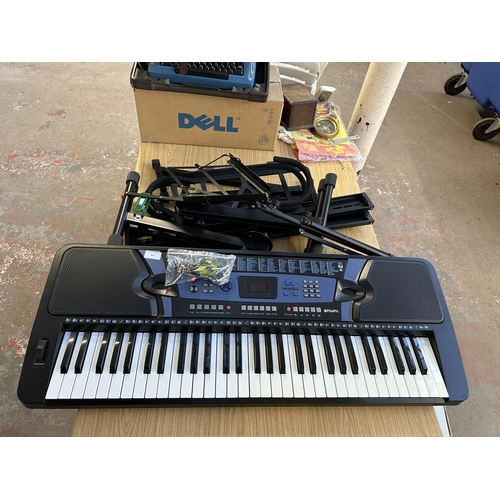 688 - An electronic keyboard with stands