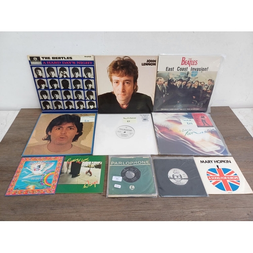 679 - A collection of The Beatles and related vinyl records to include 'A Hard Day's Night' (mono), 'Lady ... 