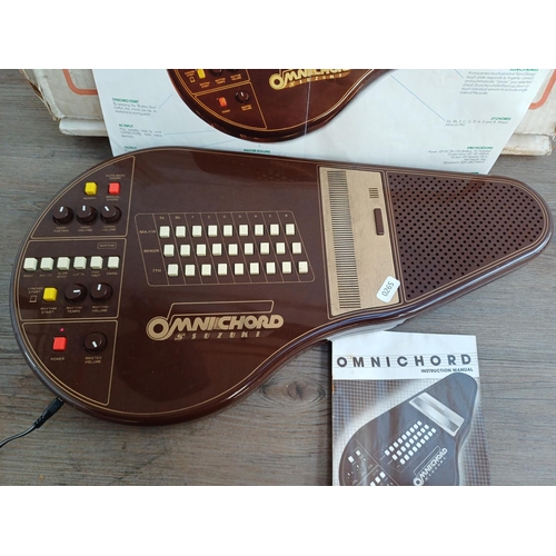 690 - A boxed early 1980s Suzuki Omnichord OM-27 electronic musical instrument with power adaptor and inst... 