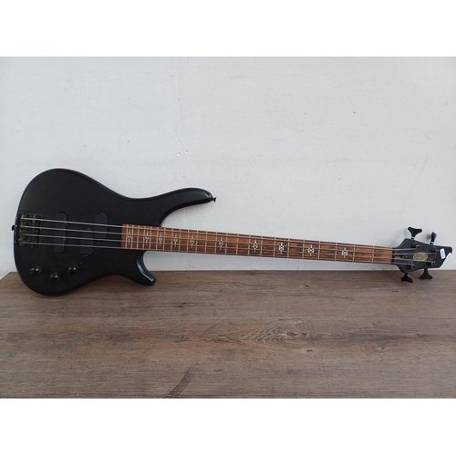 691 - A Stagg matt black four-string electric bass guitar