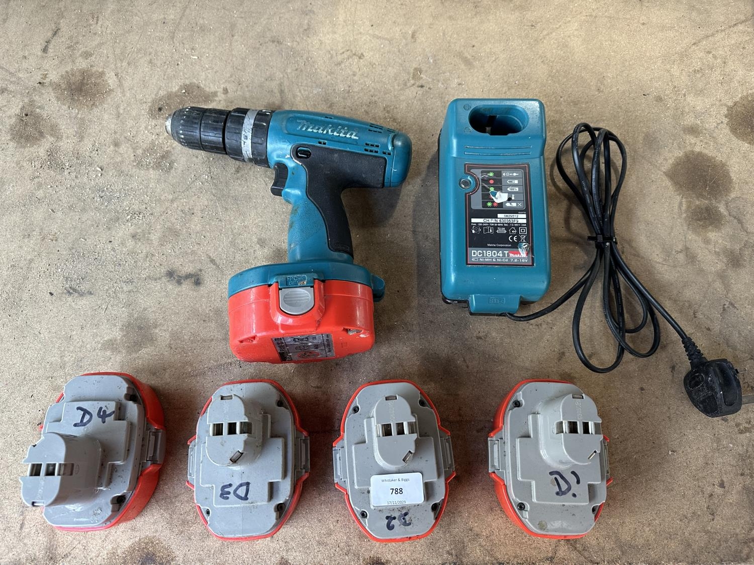 A Makita 8390D 18v cordless hammer drill with five batteries and