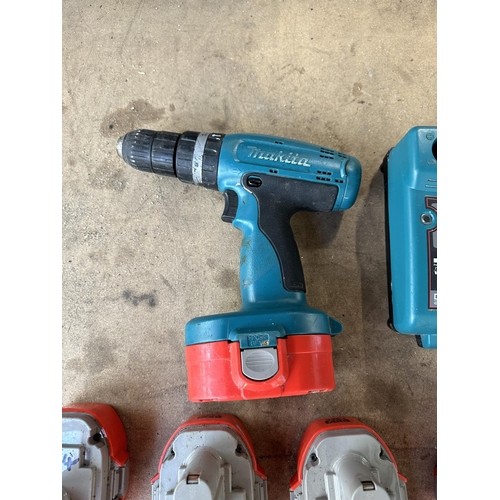 A Makita 8390D 18v cordless hammer drill with five batteries and