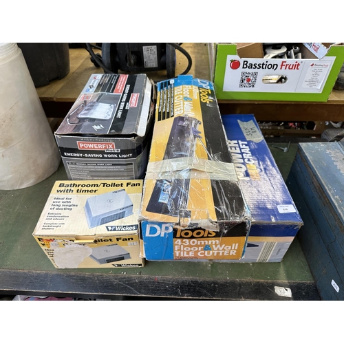 838 - Four boxed items to include Powercraft router table, DP Tools floor and wall tile cutter etc.