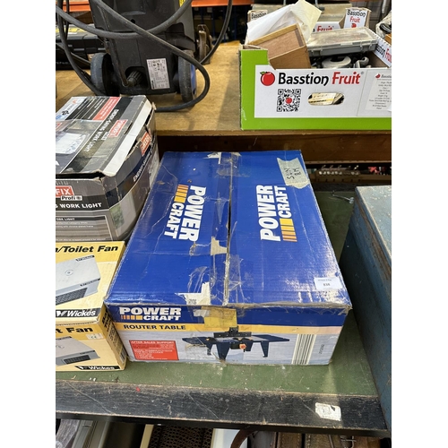 838 - Four boxed items to include Powercraft router table, DP Tools floor and wall tile cutter etc.