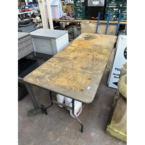 854 - A folding table - approx. 76cm high x 183cm long x 76cm wide