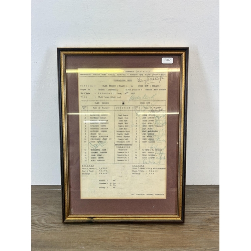 507 - A framed 1976 team sheet detailing a match between Stoke City and Slask Wroscow featuring the signat... 